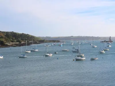 a large group of boats sitting in the water at Blackbird Cottage in Falmouth