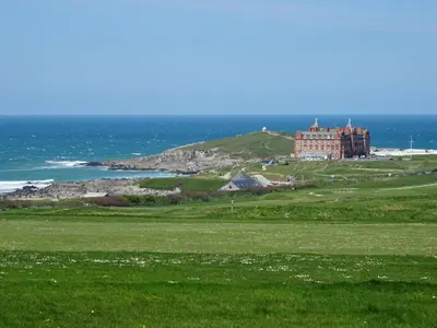 a castle on top of a hill near the ocean at Kingsley House - Free Parking & WiFi - Close to Newquay's Beaches in Newquay