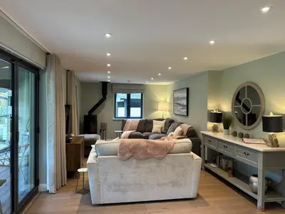 a living room with a couch and a table at Primrose in Bodmin