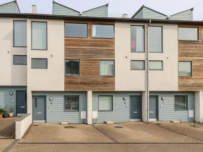 an apartment building with blue doors at 5 Quay Court in Newquay