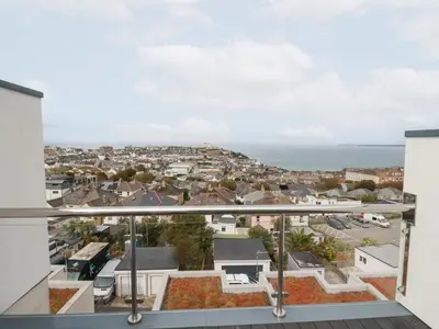 a view of the city from the balcony of a house at 5 Quay Court in Newquay
