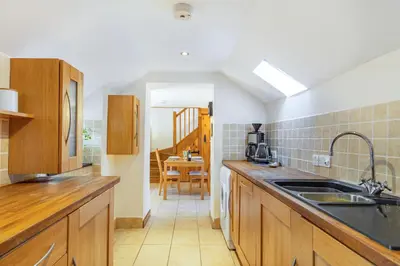 a kitchen with a sink and a counter top at Miller's Lodge in Liskeard