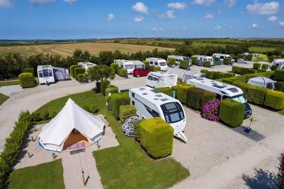 an aerial view of a group of rvs and tents at The Laurels Holiday Park & Cottages nr Padstow and Wadebridge in Wadebridge