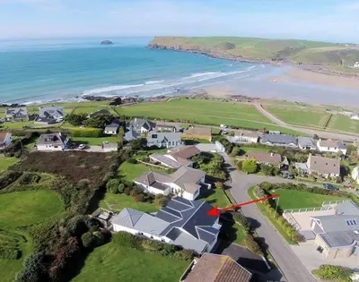 an aerial view of a house next to the ocean at Sea Mist in Polzeath