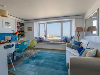a living room with a couch and a table at Men an Mor in St Ives