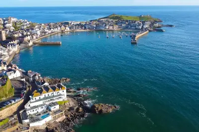 an aerial view of a town and the ocean at Men an Mor in St Ives