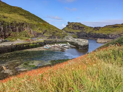 a group of boats in a river with a bridge at Trevivian House in Boscastle