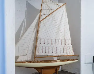 a model of a sail boat on a stand at Cloam Cottage in Port Isaac
