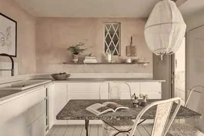 a kitchen with a table with two books on it at The Tidal Shore - Adults Only - in Marazion