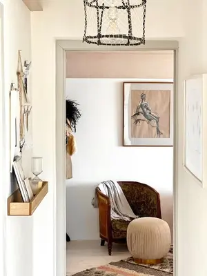 a man sitting in a chair in a living room at The Tidal Shore - Adults Only - in Marazion