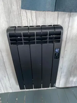 a black radiator sitting on top of a wall at 94 Newquay Bay Resort pet friendly in Newquay