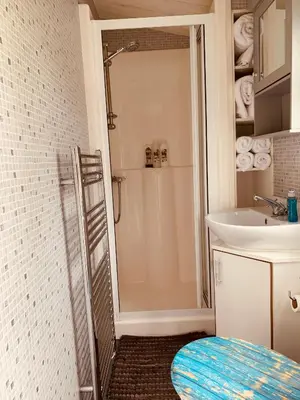 a bathroom with a shower and a sink at 94 Newquay Bay Resort pet friendly in Newquay
