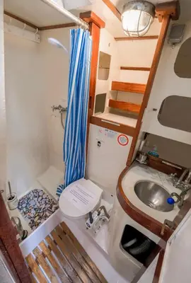 a small bathroom with a sink and a toilet at Stunning Yacht Sea Lion in Charlestown Harbour, Cornwall in Charlestown