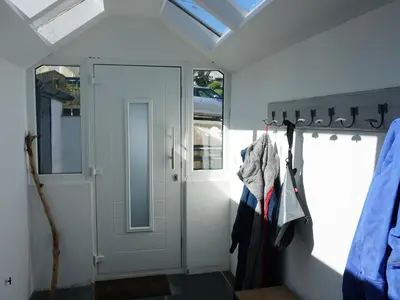 a room with a door and a window and a door at The Porthole in Port Isaac