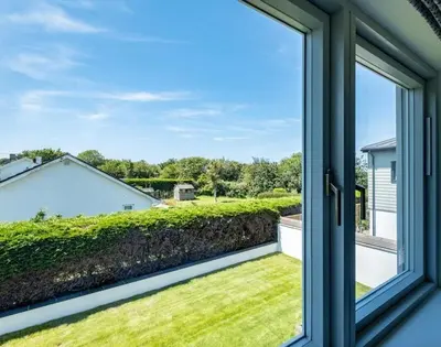 an open window with a view of a yard at Artemis in Saint Minver