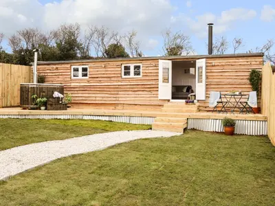 a small wooden house with a backyard at Sebright in St Austell