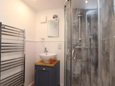 a bathroom with a sink and a shower at Sebright in St Austell