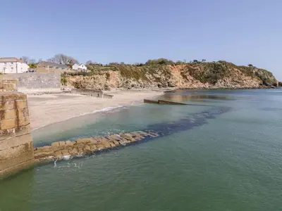 an aerial view of a beach next to the water at Sebright in St Austell