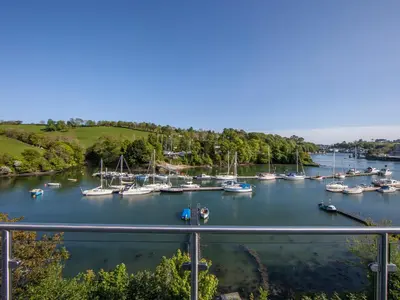 a marina with many boats in the water at Creekside House in Fowey