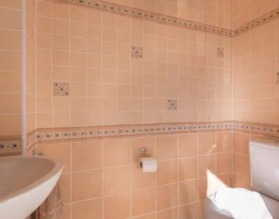a bathroom with a sink and a toilet and a tub at Polmorla in Polzeath