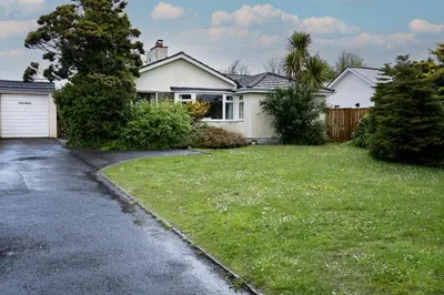 a house with a yard with a driveway at Pencreek in Padstow