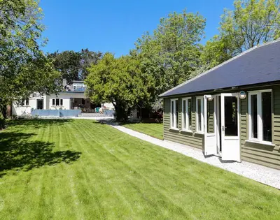 a house with a large lawn in front of it at Trevanion in Saint Minver