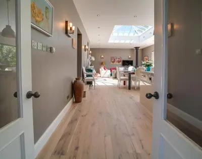 a hallway with a dining room and a living room at Trevanion in Saint Minver