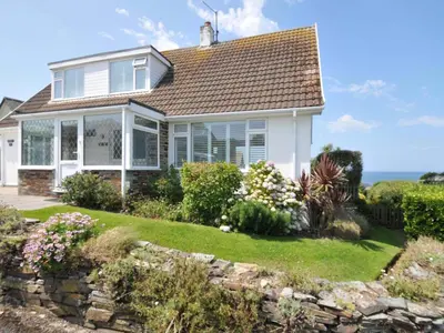 a house with a view of the ocean at Sunset in Polzeath