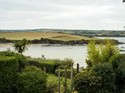 a view of a river with a boat in it at Little Strand in Padstow