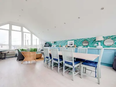 a dining room with a table and chairs at The Point in Polzeath