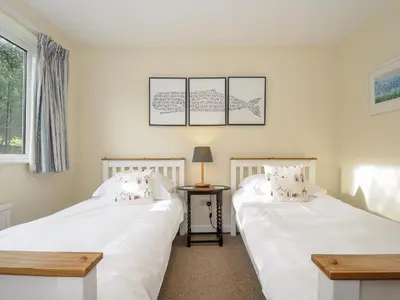 two beds sitting next to each other in a room at Trevega in Polzeath
