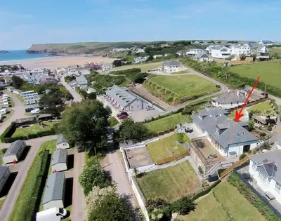 an aerial view of a town with a beach at Pendaveli in Polzeath