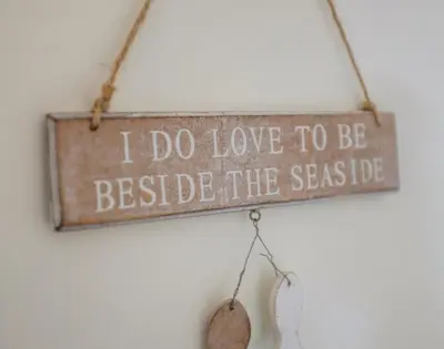 a sign that says i do love to be beside theseido at Pendaveli in Polzeath