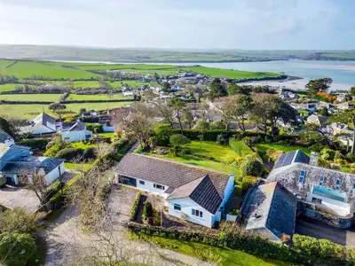 an aerial view of a village with houses and the water at Rock Hill in Padstow