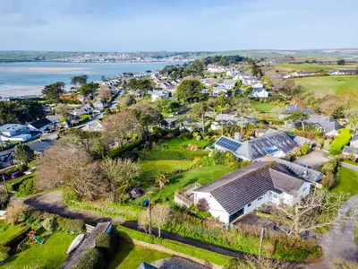 an aerial view of a village with houses and the water at Rock Hill in Padstow