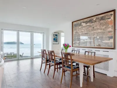 a dining room with a table and chairs at Treverden in Polzeath