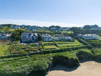 an aerial view of a house on the beach at Treverden in Polzeath