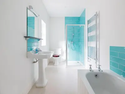 a bathroom with a white tub and a sink and a bath tub at Treverden in Polzeath