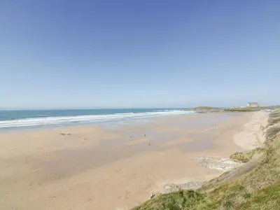 a view of a beach with people walking on the sand at Fistral Apres Surf in Newquay