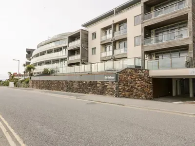 an empty street in front of a building at Fistral Apres Surf in Newquay