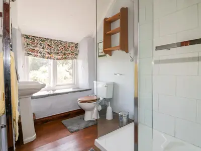a bathroom with a toilet and a window at Little Trespettigue in Launceston