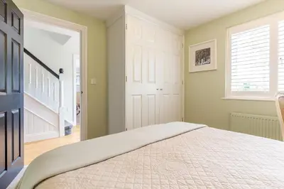 a bedroom with a bed and a window at Armando in Truro