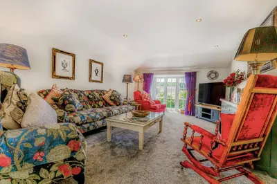 a living room with a couch and a chair at Armando in Truro