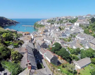 an aerial view of a town next to the ocean at Crow's Nest in Port Isaac