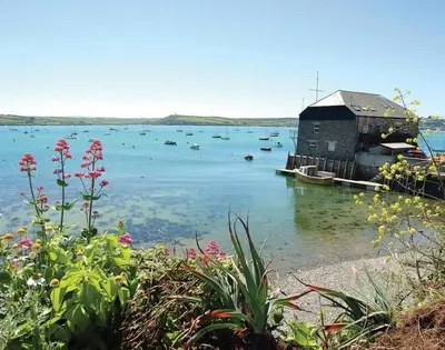 a large body of water with boats in it at Kipper Cottage in Port Isaac