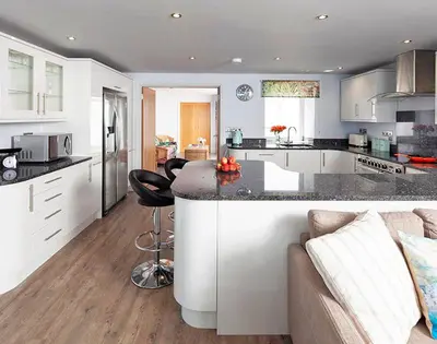 a kitchen with a large island in a room at The Crows Nest in Port Isaac