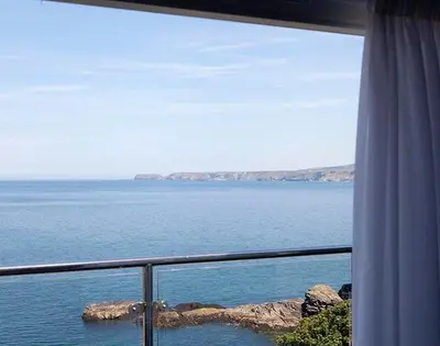 a view of the ocean from a balcony at The Crows Nest in Port Isaac