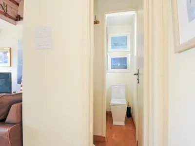a bathroom with a toilet in a room at Beachside in Polzeath