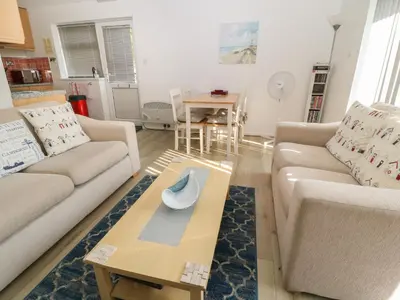 a living room with two couches and a coffee table at Ballasalla in Liskeard