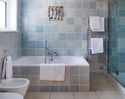 a bathroom with a tub and a sink at The White House in Polzeath